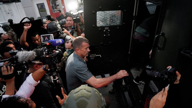 erik-prince-climbing-into-an-armoured-personnel-carrier-in-guayaquil-ecuador.JPG