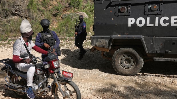 police-officers-patrolling-in-port-au-prince-s-kenscoff-neighbourhood.jpg