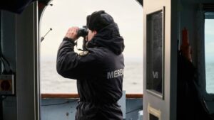 man-looking-out-to-baltic-sea-from-vantage-point-of-estonian-naval-ship.jpg