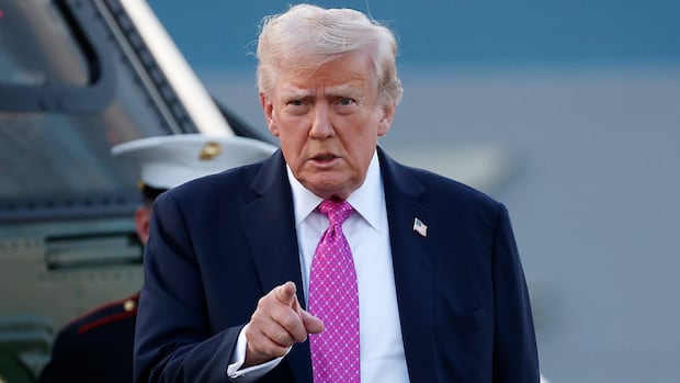 u-s-president-donald-trump-pointing-his-index-finger-while-walking.jpg